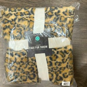 Brand new leopard faux fur throw. 50in X 60in